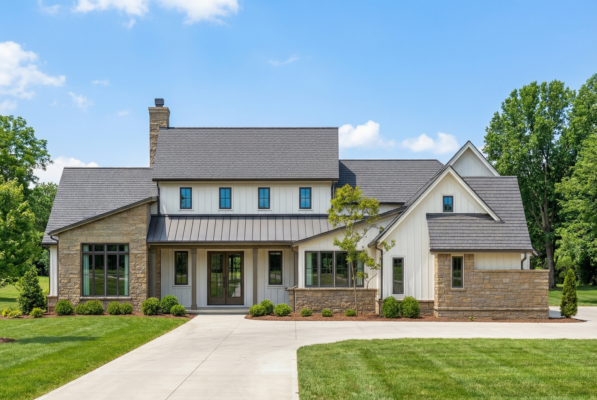 Modern Farmhouse + Metal Roof designed by Hyden Design Group.